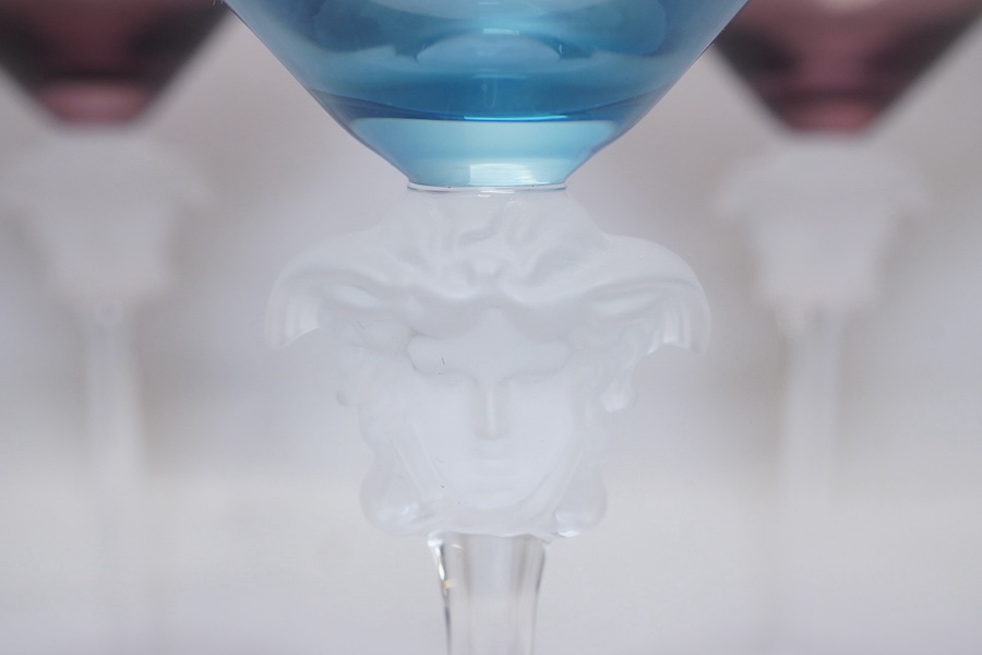 Five boxed Rosenthal for Versace Medusa head champagne glasses in various colours, 17.5cm high. Condition - good.